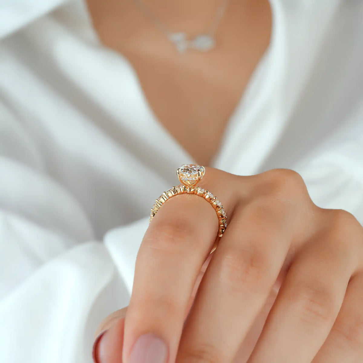 Oval Lab Grown Diamond Engagement Ring with Round Diamond Side Stones