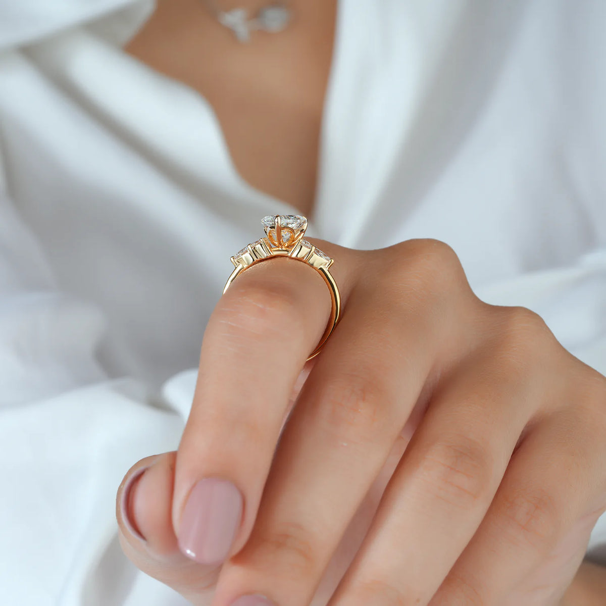 Pear Cut Lab Grown Diamond Engagement Ring with Round and Pear Cluster Accents