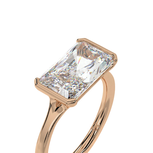 East-West Radiant Cut Bezel Set Lab Grown Diamond Solitaire Engagement Ring in Yellow Gold