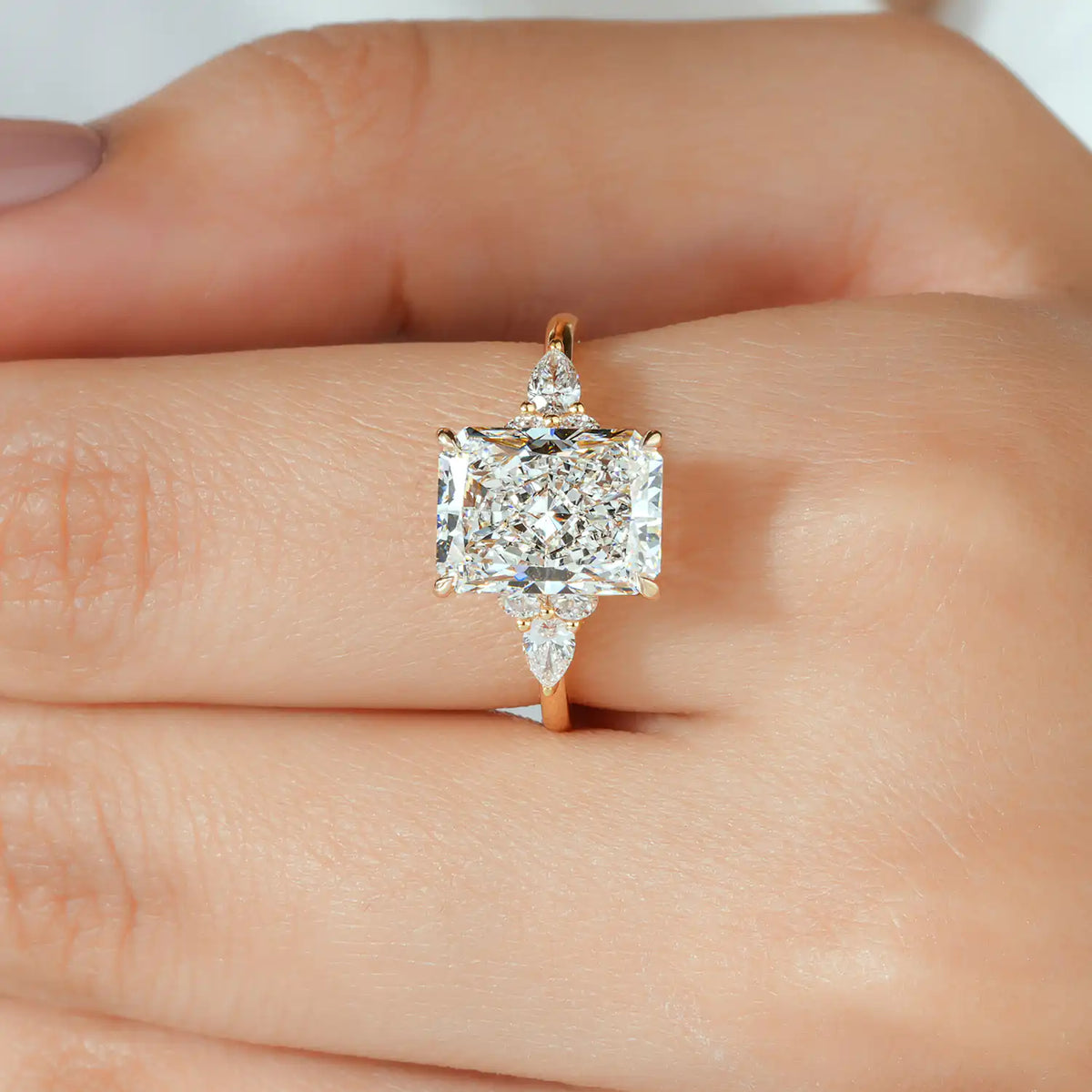Radiant Cut Lab Grown Diamond Engagement Ring with Pear and Round Diamond Clusters
