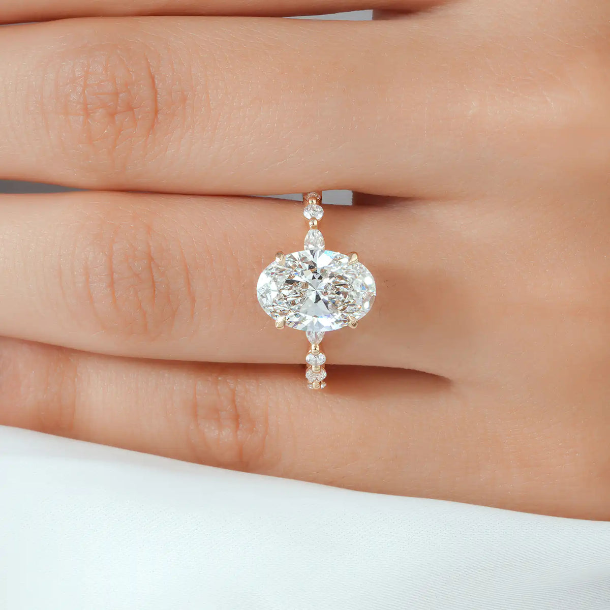 Oval Lab Grown Diamond Hidden Halo Ring with Pear and Round Accents