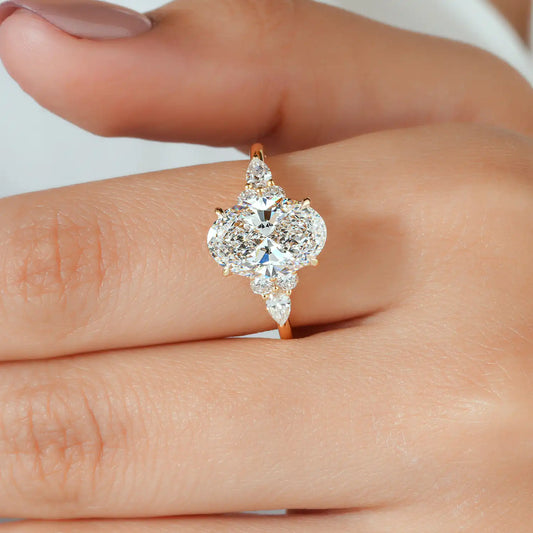 Oval Lab Grown Diamond Engagement Ring with Pear and Round Side Stones
