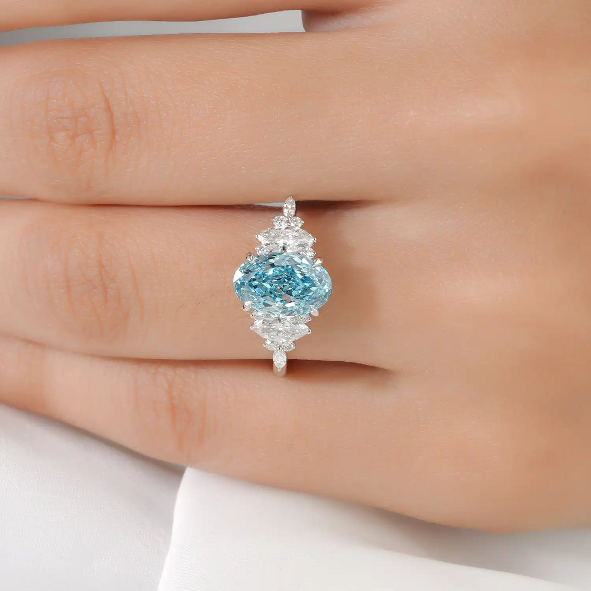 Blue Oval Lab Grown Diamond Ring with Marquise and Round Side Stones