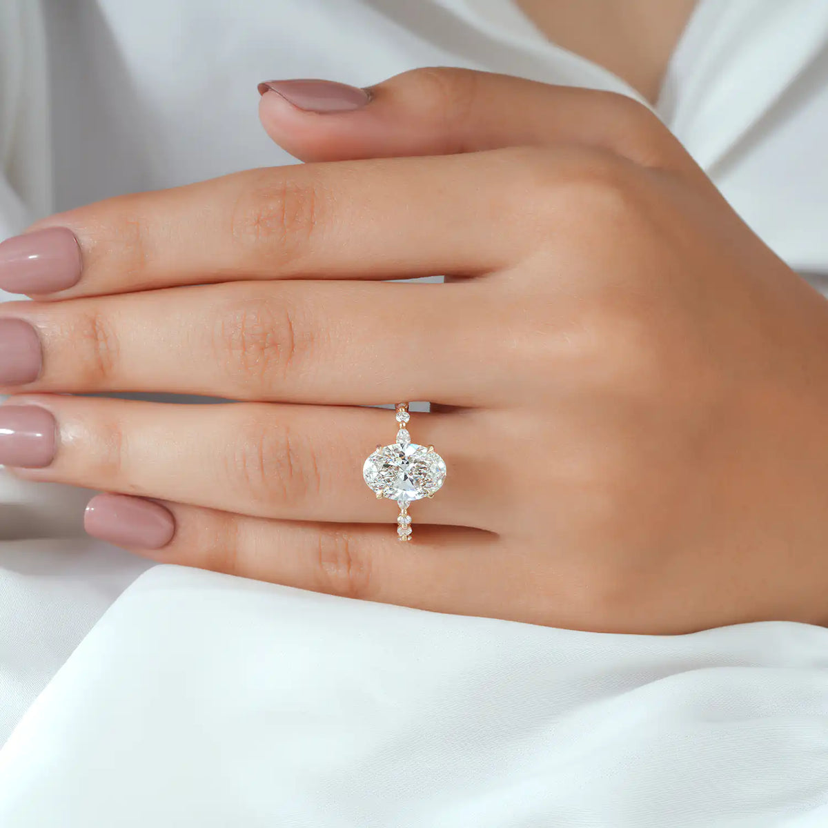 Oval Cut Diamond Ring with Graduated Diamond Shoulders