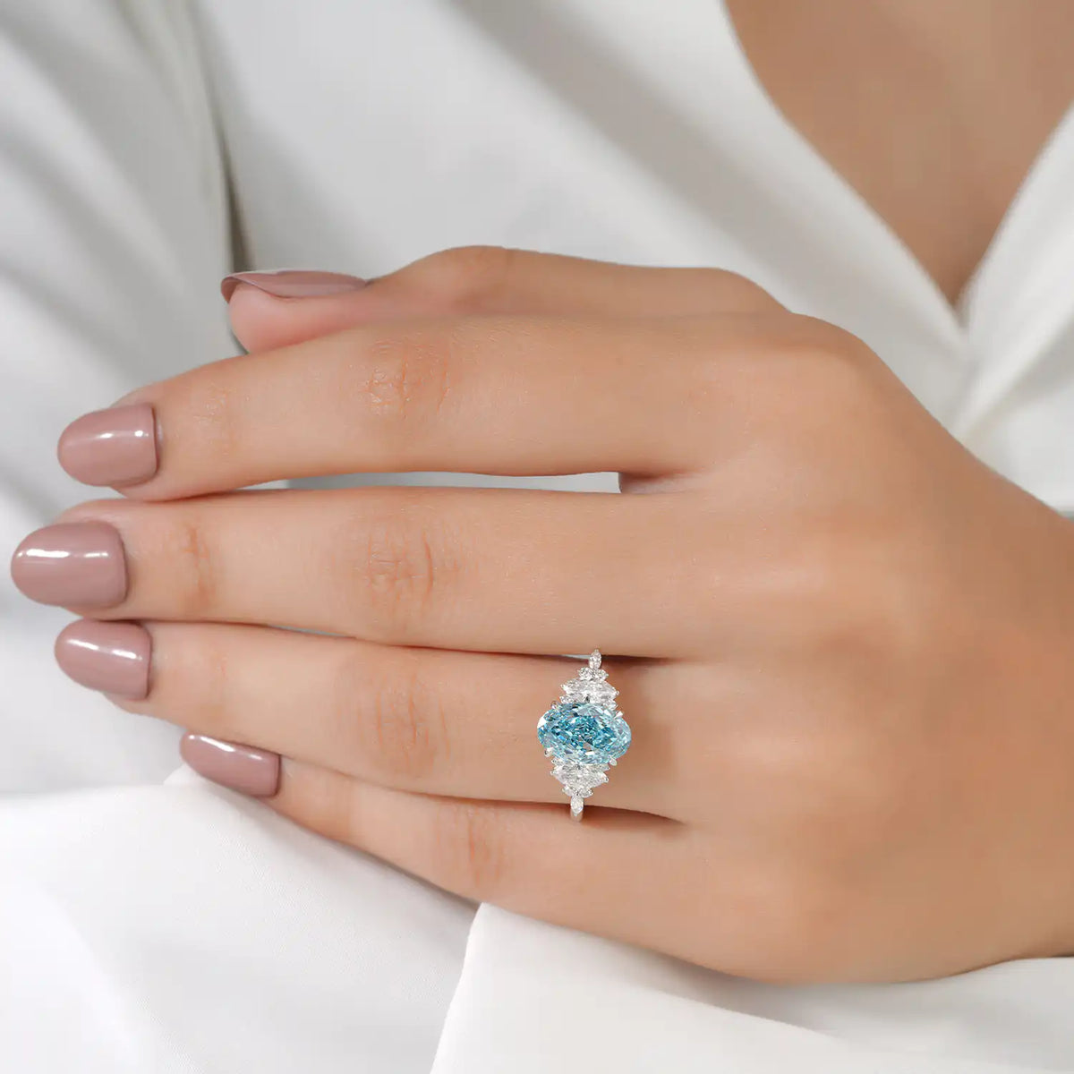 Blue Oval Lab Grown Diamond Ring with Marquise and Round Side Stones