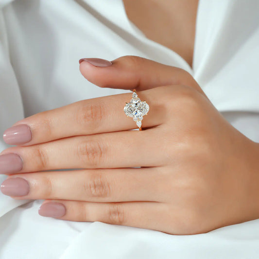 Oval Cut Diamond Ring with Pear and Round Cluster Sides
