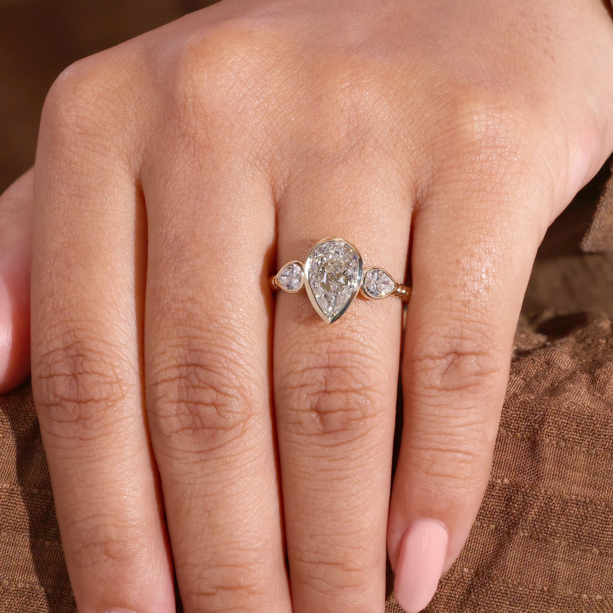 Pear Lab Grown Diamond Three Stone Bezel Ring, Reeded Ring