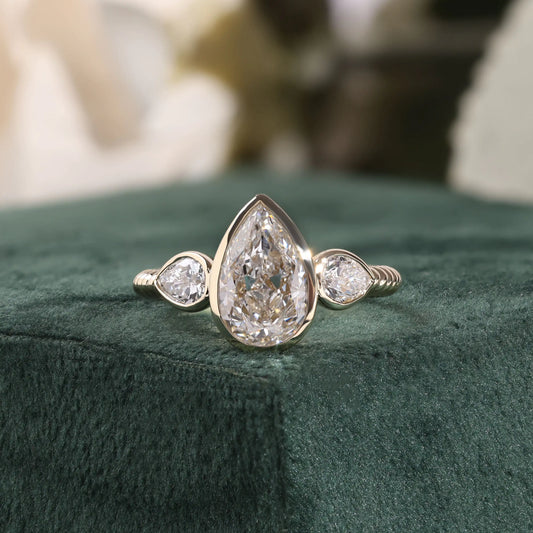 Pear Lab Grown Diamond Three Stone Bezel Ring, Reeded Ring