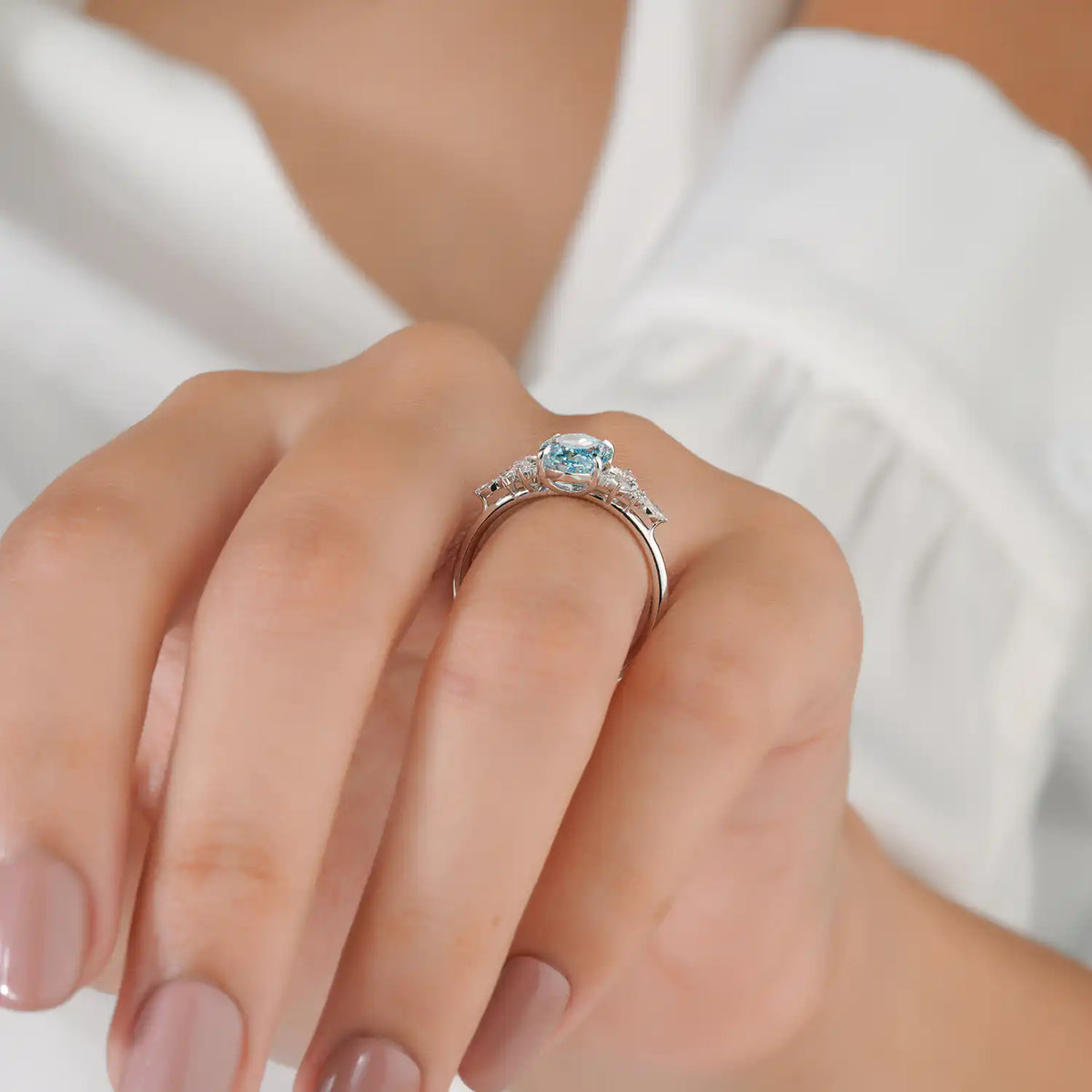 Blue Oval Lab Grown Diamond Ring with Marquise and Round Side Stones