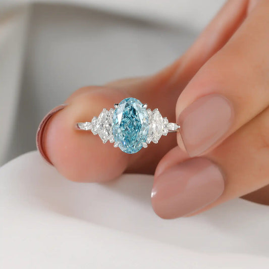 Blue Oval Lab Grown Diamond Ring with Marquise and Round Side Stones