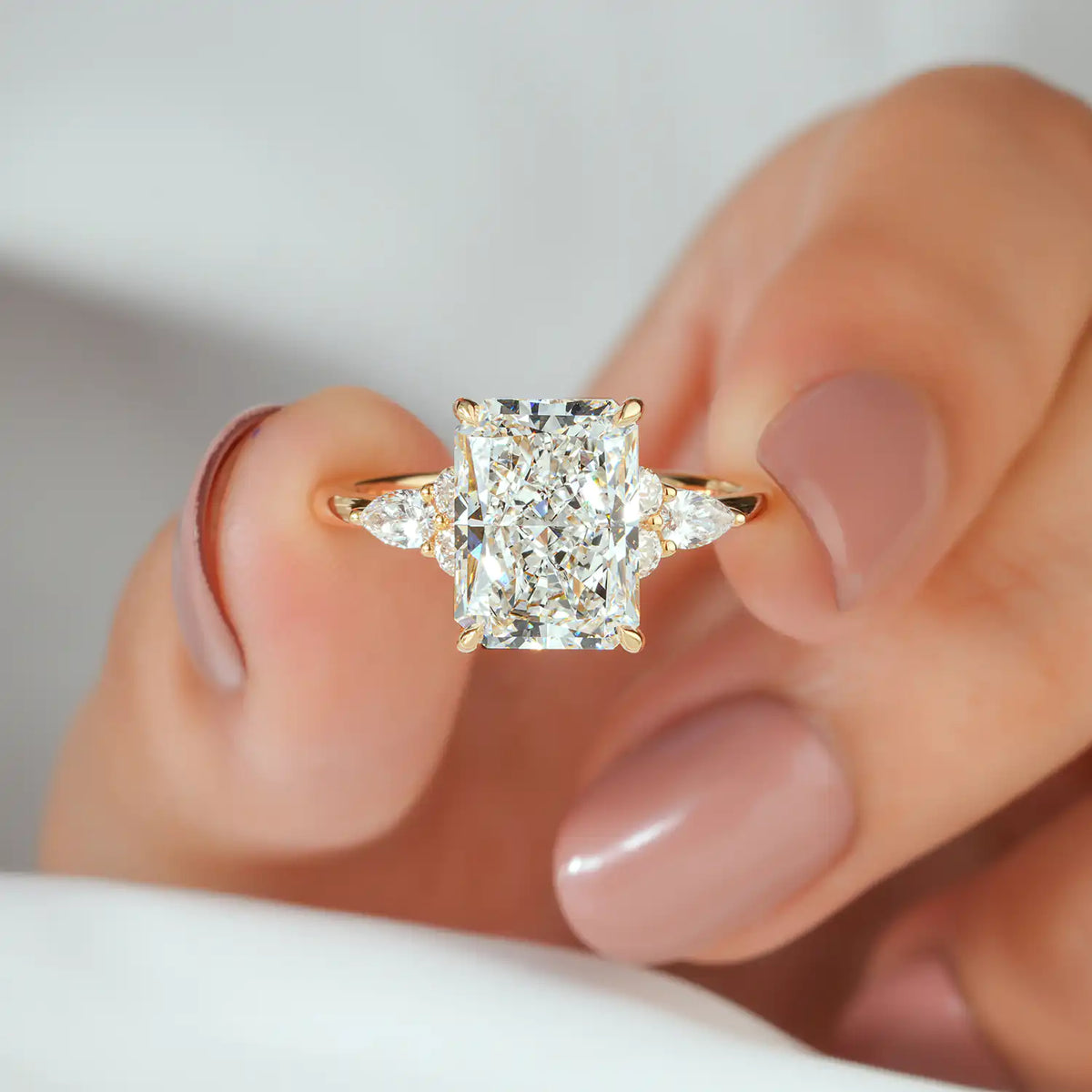 Radiant Cut Lab Grown Diamond Engagement Ring with Pear and Round Diamond Clusters