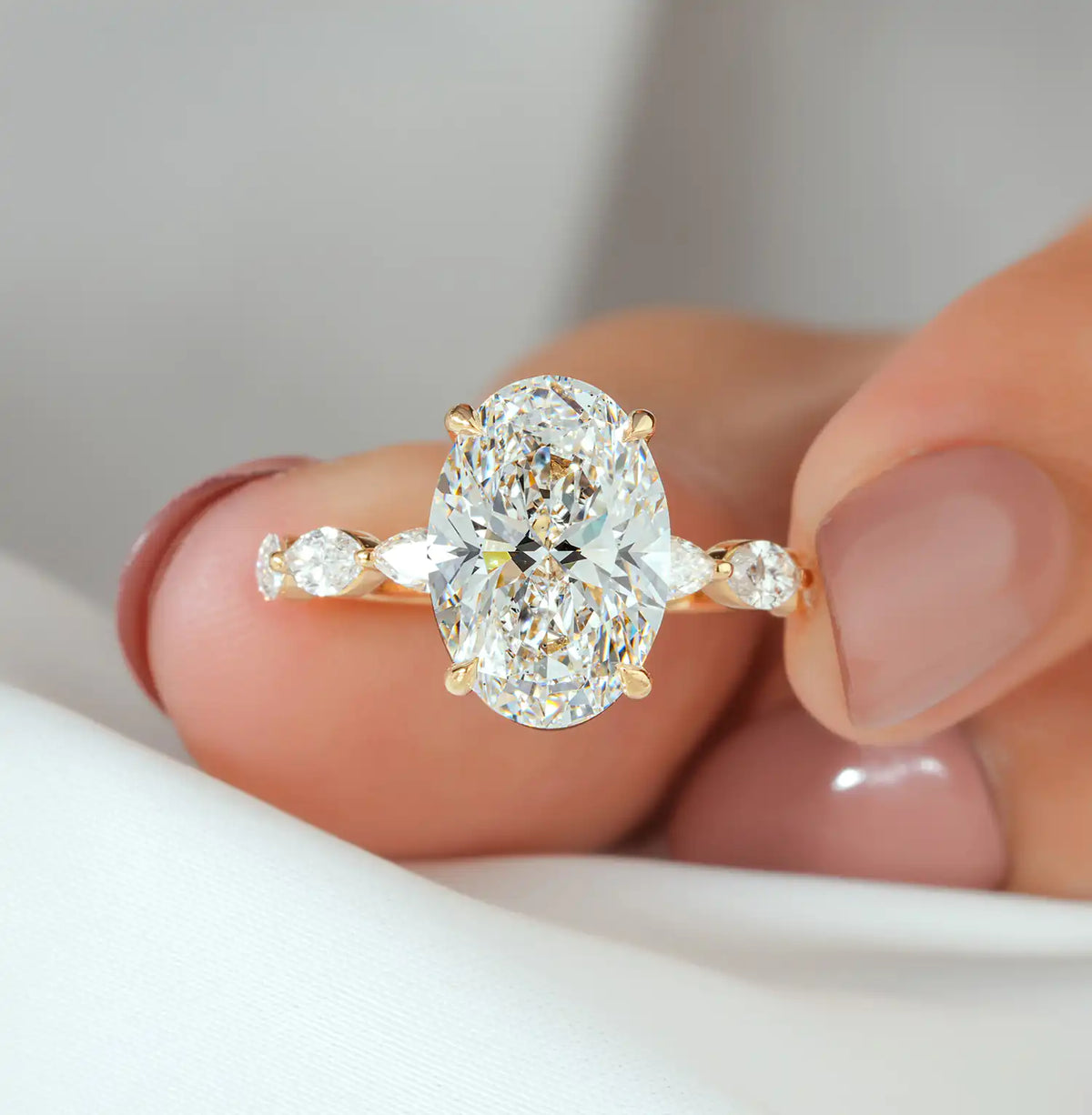 Oval Cut Diamond Ring with Hidden Halo and Marquise Sides