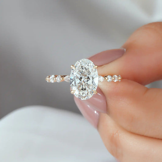Oval Cut Diamond Ring with Graduated Diamond Shoulders