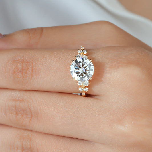 Round Lab Grown Diamond Four Prong Engagement Ring with Scattered Cluster Side Diamonds in Gold or Platinum