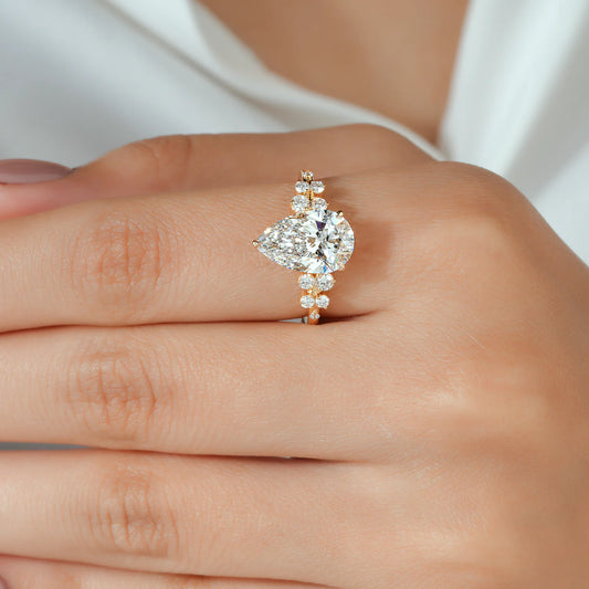 Pear Cut Lab Grown Diamond Engagement Ring with Graduated Round Cluster Shoulders