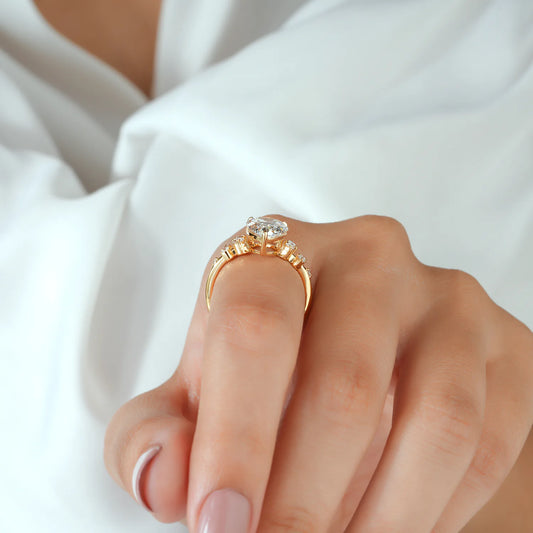 Pear Cut Lab Grown Diamond Engagement Ring with Graduated Round Cluster Shoulders