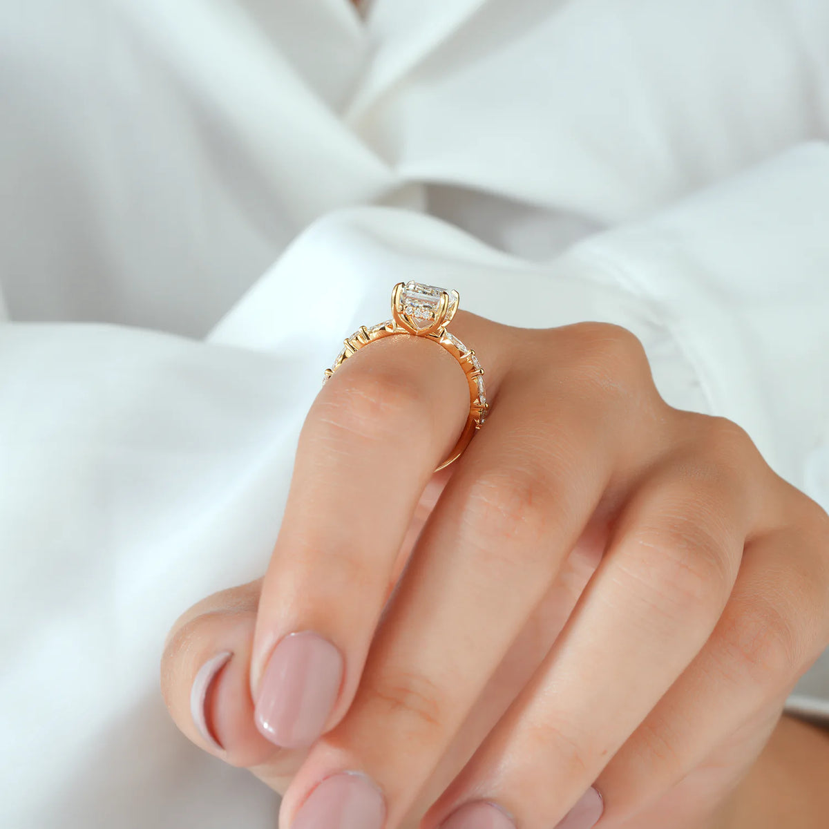 Emerald Cut Ring with Spaced Diamond Clusters