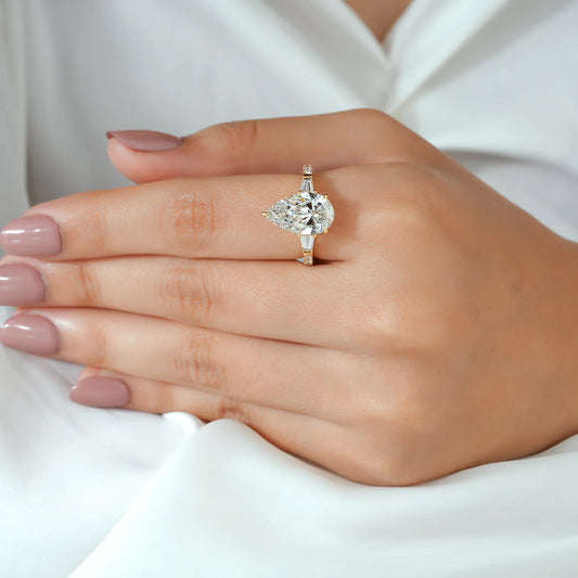 Pear and Baguette Cut Lab Grown Diamond Three-Stone Engagement Ring with Pave Ring in Yellow Gold