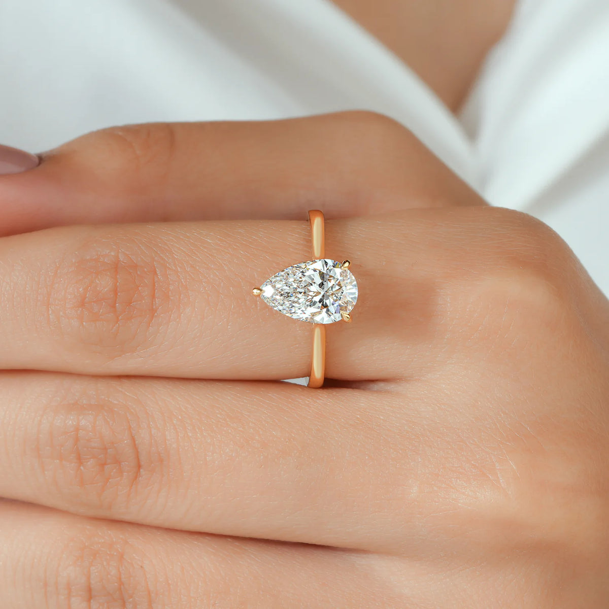 Pear Shaped Solitaire Lab Grown Diamond Engagement Ring with Hidden Diamond Accent