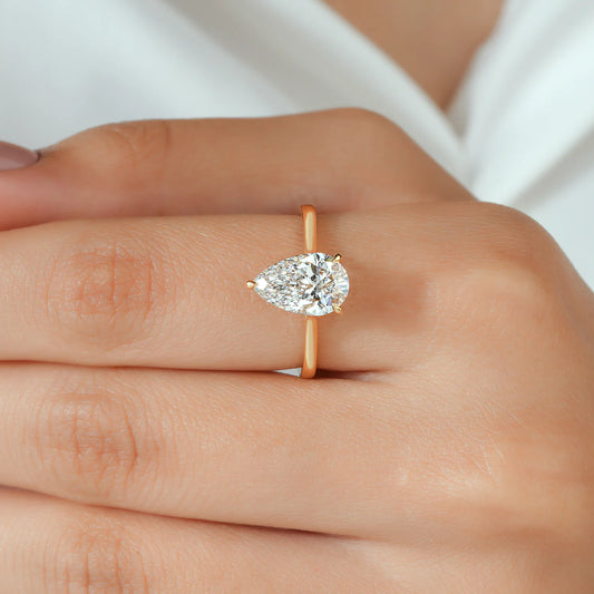 Pear Shaped Solitaire Lab Grown Diamond Engagement Ring with Hidden Diamond Accent