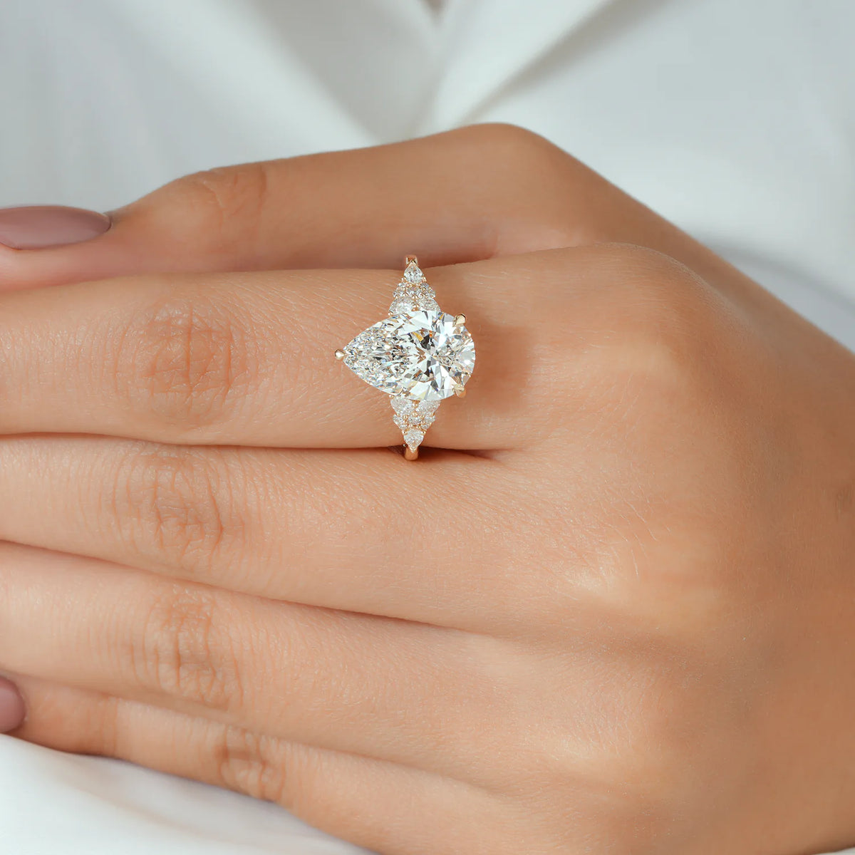 Pear Cut Lab Grown Diamond Cluster Side Stone Engagement Ring in Yellow Gold