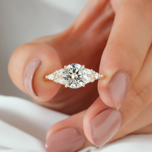 Round Lab Grown Diamond Four Prong Engagement Ring with Pear and Round Cluster Shoulders in Gold or Platinum