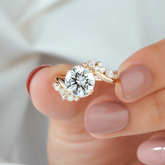 Round Lab Grown Diamond Four Prong Bypass Engagement Ring with Marquise and Round Cluster Side Diamonds in Gold or Platinum