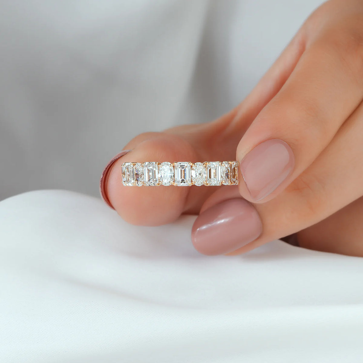 Alternating Emerald and Oval Diamond Half Eternity Band