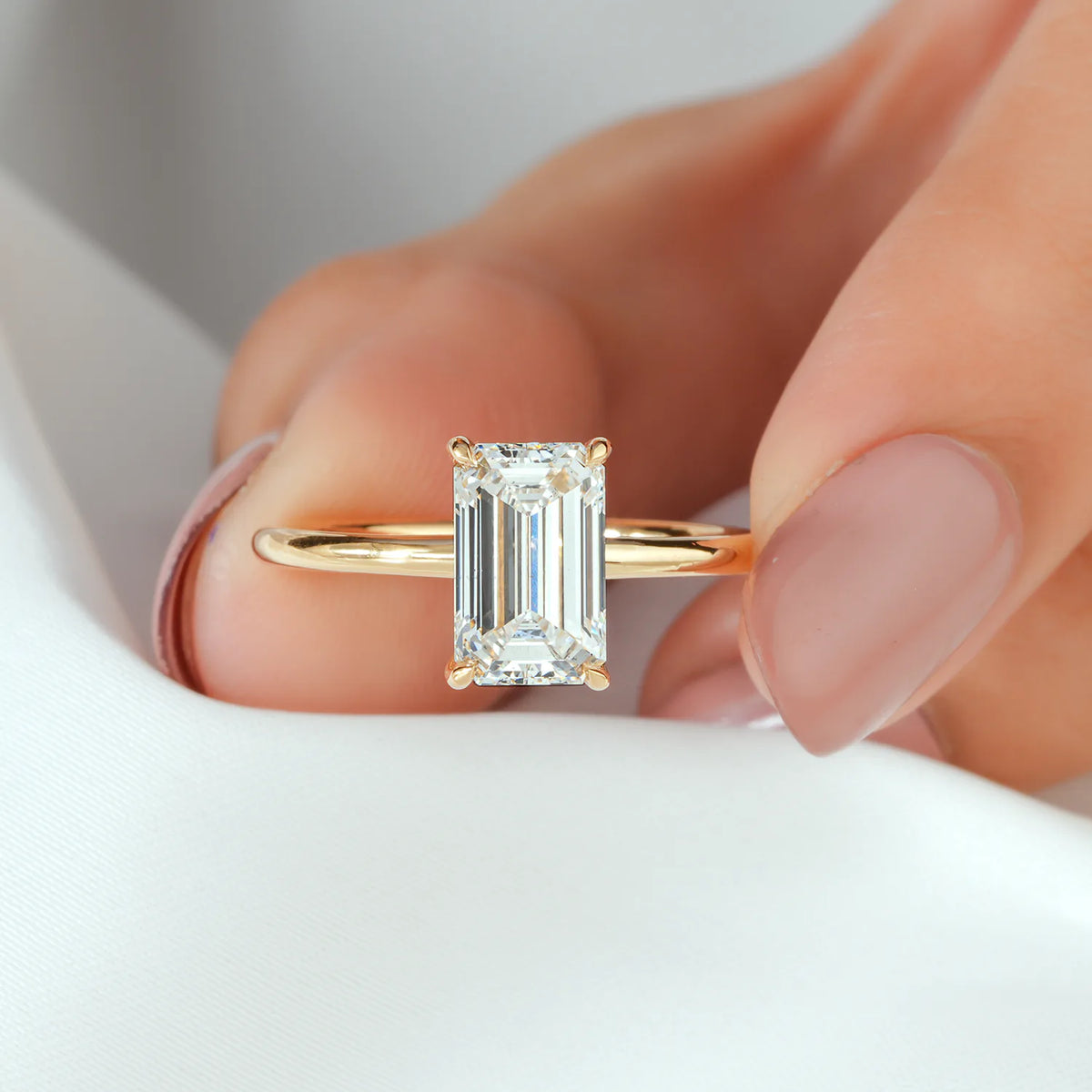 Emerald Cut Solitaire Ring with Hidden Accent