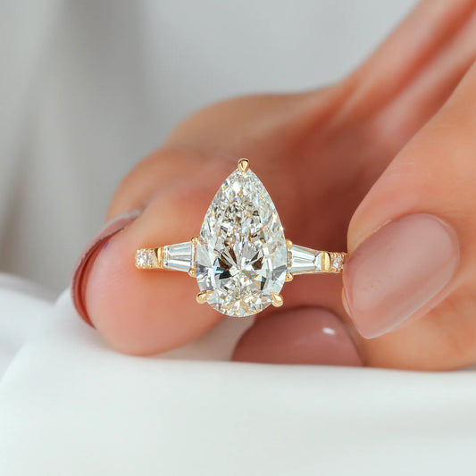 Pear and Baguette Cut Lab Grown Diamond Three-Stone Engagement Ring with Pave Ring in Yellow Gold