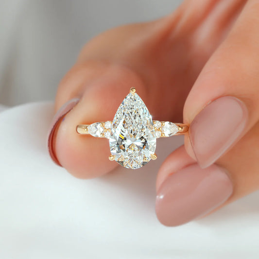 Pear Cut Lab Grown Diamond Engagement Ring with Round and Pear Cluster Accents
