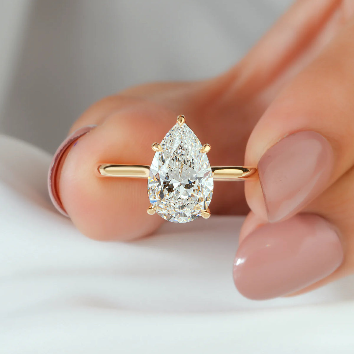 Pear Shaped Solitaire Lab Grown Diamond Engagement Ring with Hidden Diamond Accent