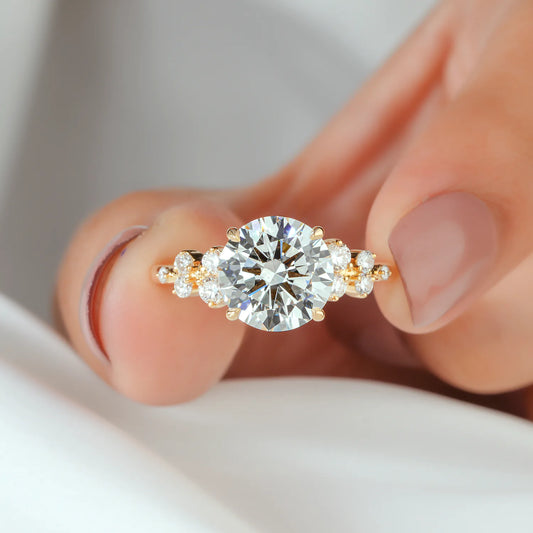 Round Lab Grown Diamond Four Prong Engagement Ring with Scattered Cluster Side Diamonds in Gold or Platinum