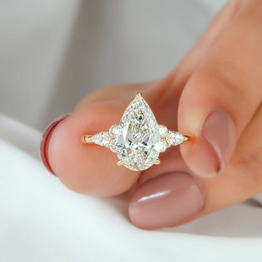 Pear and Round Cut Lab Grown Diamond Cluster Engagement Ring in Yellow Gold