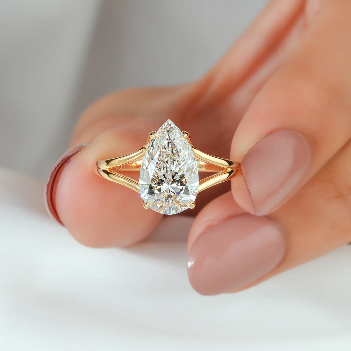 Pear Shaped Lab Grown Diamond Engagement Ring with Split Shank and Hidden Pave Accent