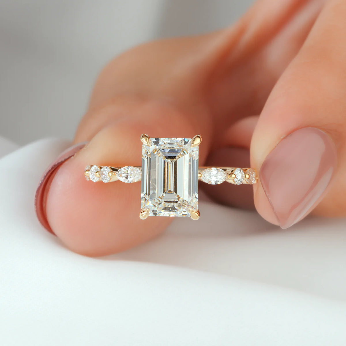 Emerald Cut Ring with Spaced Diamond Clusters
