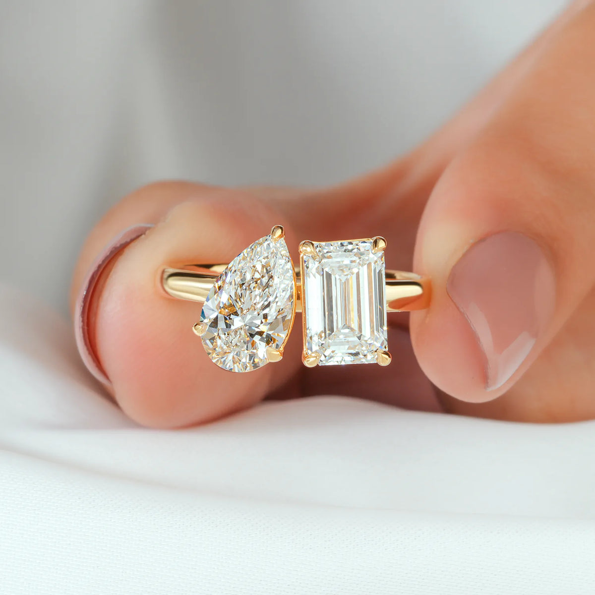 Emerald and Pear Diamond Toi et Moi Ring