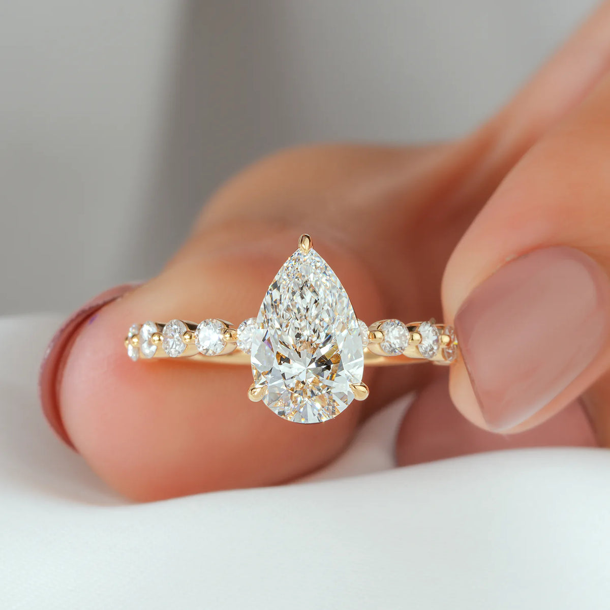 Pear Shaped Lab Grown Diamond Engagement Ring with Floating Round Diamond Band