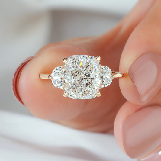 Cushion Cut Lab Grown Diamond Four Prong Three Stone Engagement Ring with Half Moon Side Diamonds in Gold or Platinum