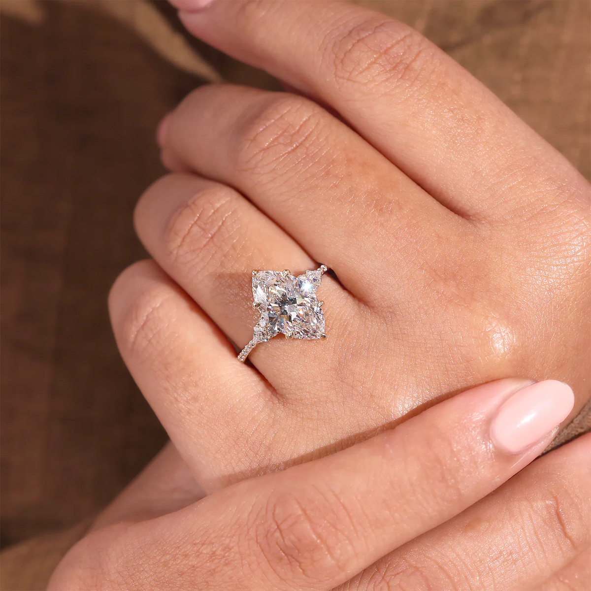 Marquise Diamond Ring with Trillion and Round Side Clusters