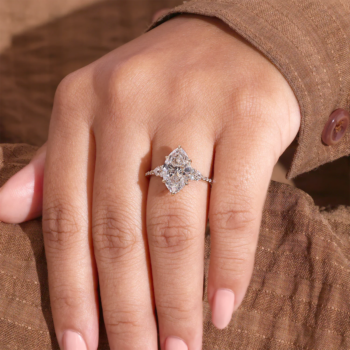 Marquise Diamond Ring with Trillion and Round Side Clusters