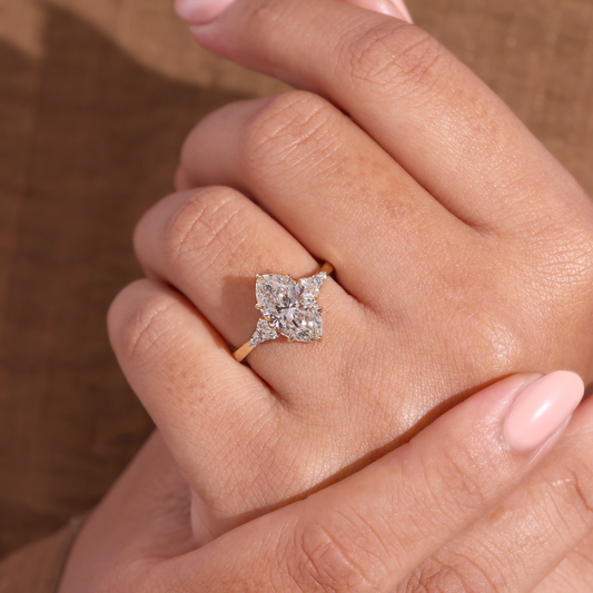 Marquise Diamond Ring with Trio Cluster Side Stones
