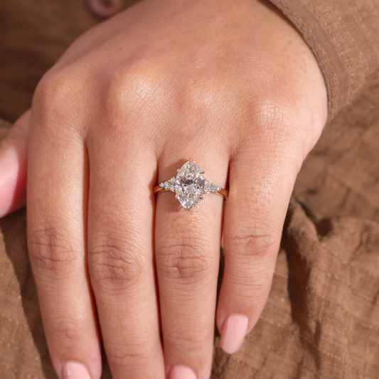 Marquise Diamond Ring with Trio Cluster Side Stones
