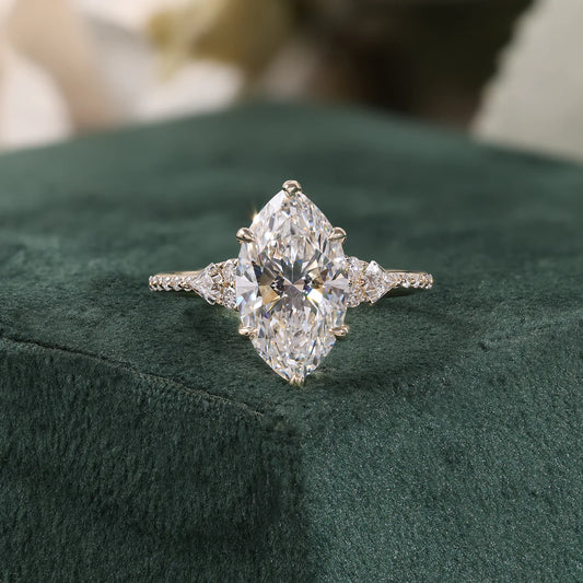 Marquise Diamond Ring with Trillion and Round Side Clusters