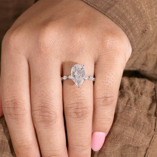 Pear Cut Lab Grown Diamond Hidden Halo Engagement Ring with Marquise Station Band
