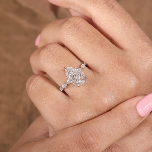Pear Cut Lab Grown Diamond Hidden Halo Engagement Ring with Marquise Station Band
