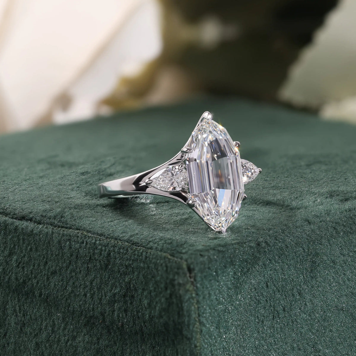 Elongated Hexagon Diamond Ring with Pear Side Stones