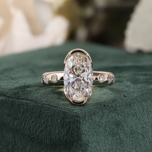 Bezel Set Oval Diamond Ring with Scattered Ring and Hidden Accent