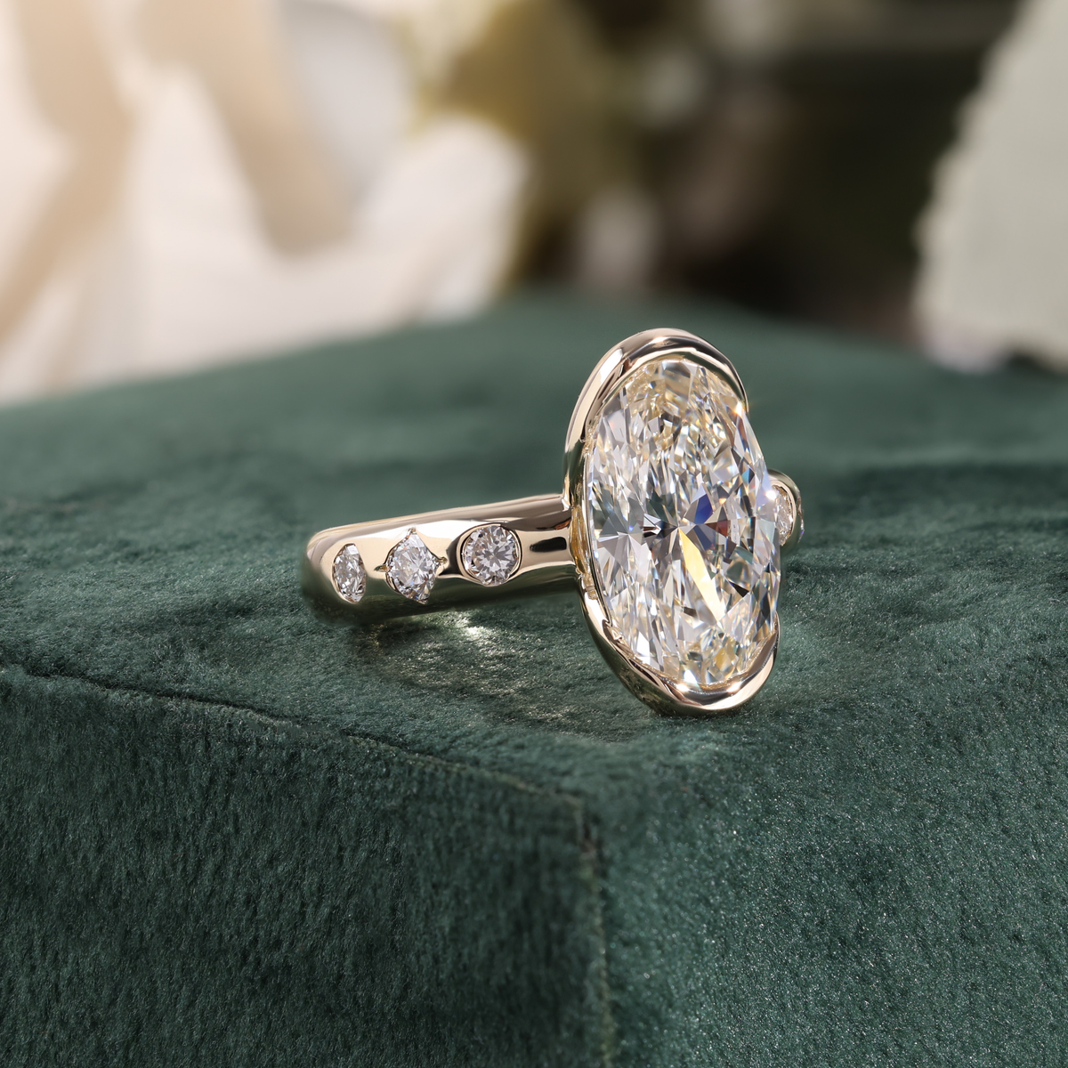 Bezel Set Oval Diamond Ring with Scattered Ring and Hidden Accent