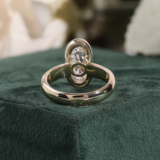Bezel Set Oval Diamond Ring with Scattered Ring and Hidden Accent